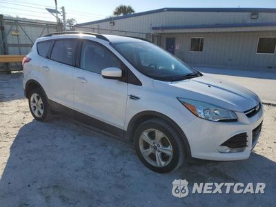 Czwarte zdjęcie samochodu z boku: 2016 FORD ESCAPE SE VIN:1FMCU0GX5GUC35285 - miniatura