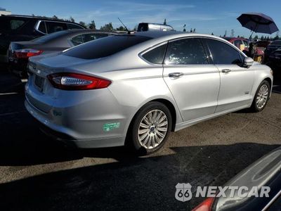 Trzecie zdjęcie samochodu z tyłu: 2016 FORD FUSION SE PHEV VIN:3FA6P0PU1GR229138 - miniatura