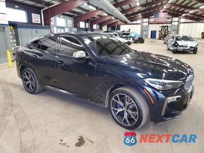 Czwarte zdjęcie samochodu z boku: 2020 BMW X6 M50I VIN:5UXCY8C05L9B64765 - miniatura
