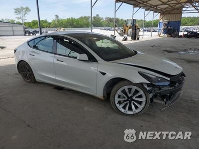 Czwarte zdjęcie samochodu z boku: 2022 TESLA MODEL 3 VIN:5YJ3E1EB3NF206808 - miniatura