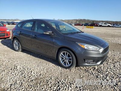 Czwarte zdjęcie samochodu z boku: 2017 FORD FOCUS SE VIN:1FADP3K25HL205391 - miniatura