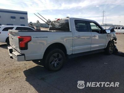 Trzecie zdjęcie samochodu z tyłu: 2023 FORD F150 LIGHTNING PRO VIN:1FT6W1EV8PWG34277 - miniatura
