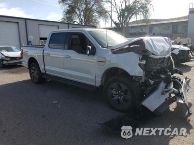 Czwarte zdjęcie samochodu z boku: 2023 FORD F150 LIGHTNING PRO VIN:1FT6W1EV8PWG34277 - miniatura