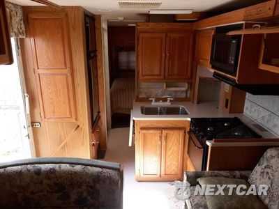 Zdjęcie 6 z 10 samochodu: 1999 FORD ECONOLINE E450 SUPER DUTY CUTAWAY VAN RV VIN:1FDXE40S1XHA56318 - miniatura