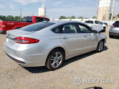 Trzecie zdjęcie samochodu z tyłu: 2018 FORD FUSION SE VIN:3FA6P0HDXJR260300 - miniatura