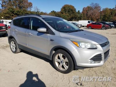 Czwarte zdjęcie samochodu z boku: 2014 FORD ESCAPE SE VIN:1FMCU0GX0EUC64304 - miniatura