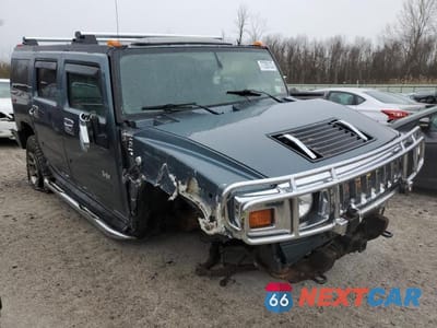 Czwarte zdjęcie samochodu z boku: 2005 HUMMER H2 VIN:5GRGN23U95H116850 - miniatura